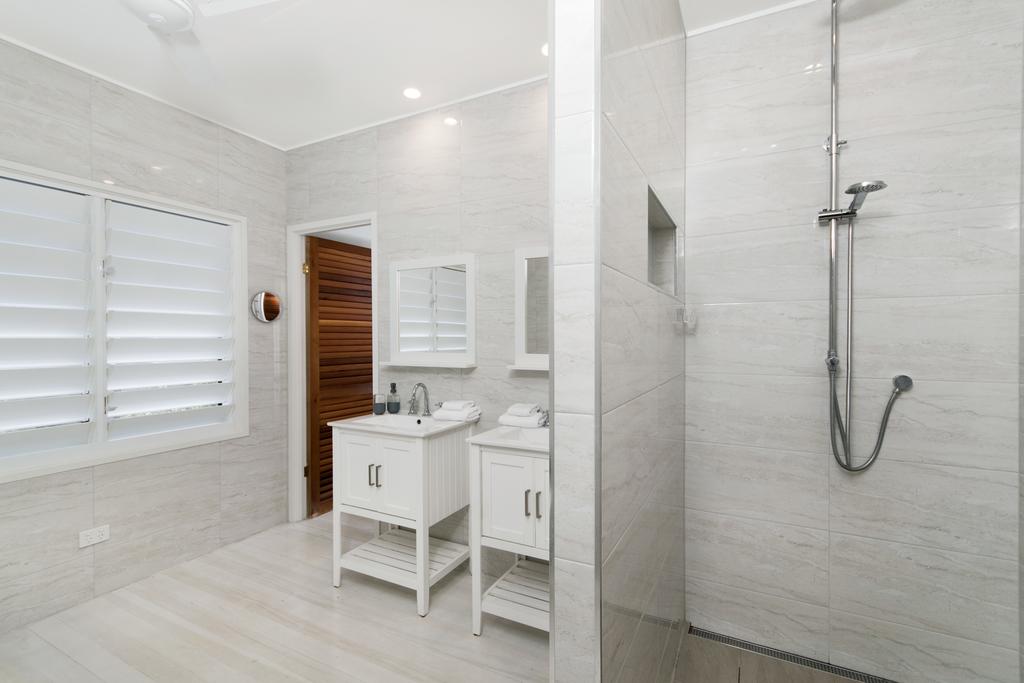 Bathers across the bay from Port Douglas